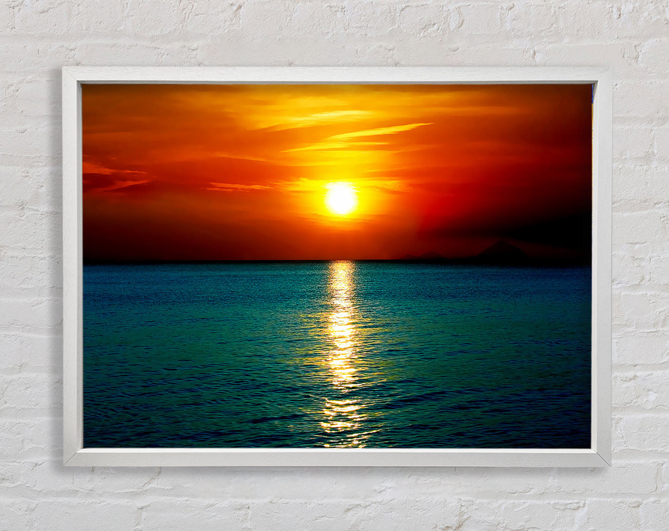 As The Sun Goes Down Over The Turquoise Ocean Framed Wall Art
