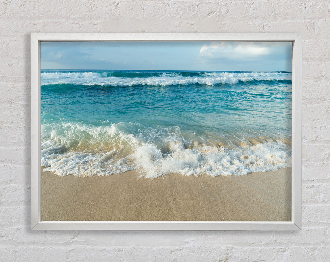 Crashing waves on the sandy beach Framed Wall Art