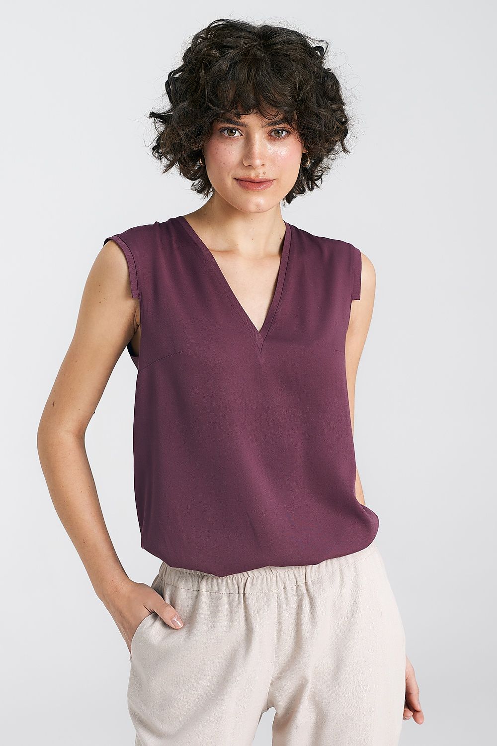 Elegant Plum Viscose Blouse With V-Neckline And Delicate Pleat Detail by Nife