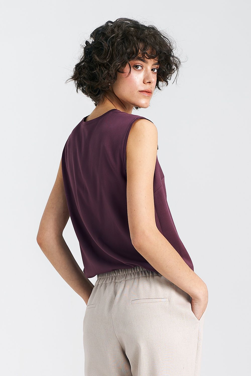 Elegant Plum Viscose Blouse With V-Neckline And Delicate Pleat Detail by Nife