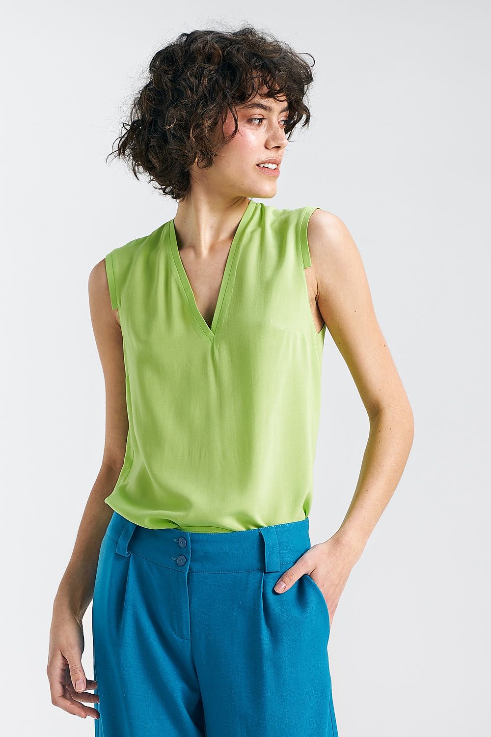 Elegant Plum Viscose Blouse With V-Neckline And Delicate Pleat Detail by Nife