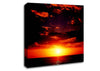 Sunset Through The Black Ocean Clouds Canvas Wall Art