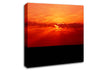 Red Sunbeams Over The Black Ocean Canvas Wall Art