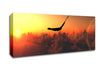 Eagle Flying In The Burnt Orange Sky Canvas Wall Art