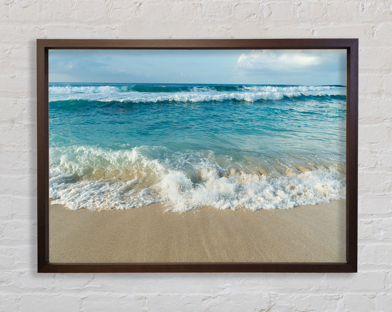 Crashing waves on the sandy beach Framed Wall Art