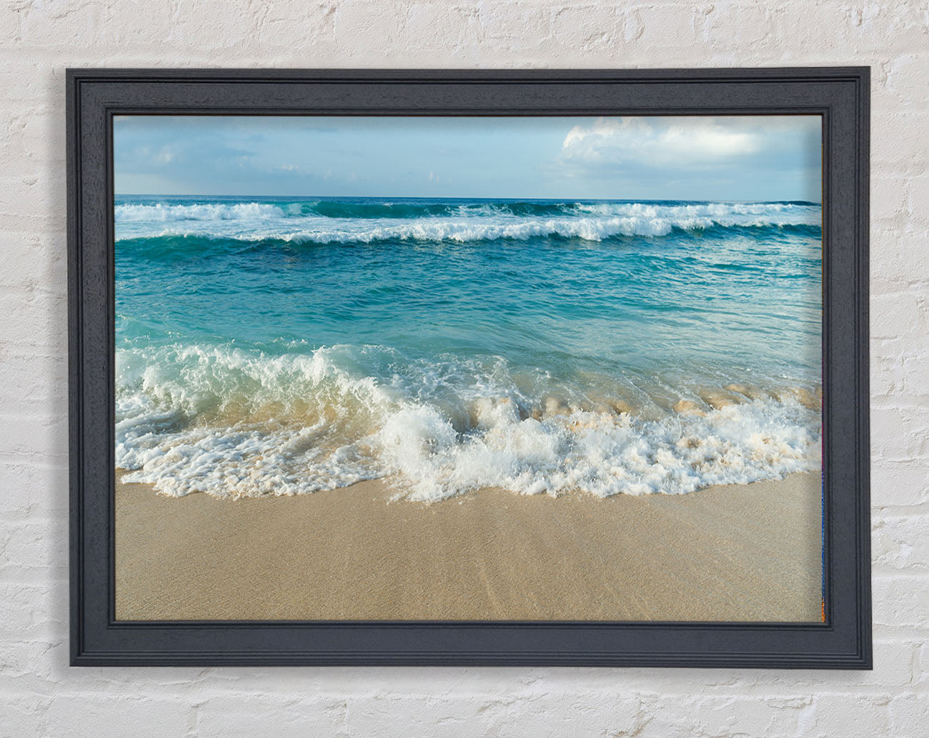 Crashing waves on the sandy beach Framed Wall Art