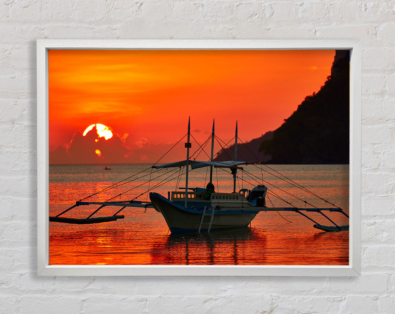 Boat sailing in the orange sunset Framed Wall Art