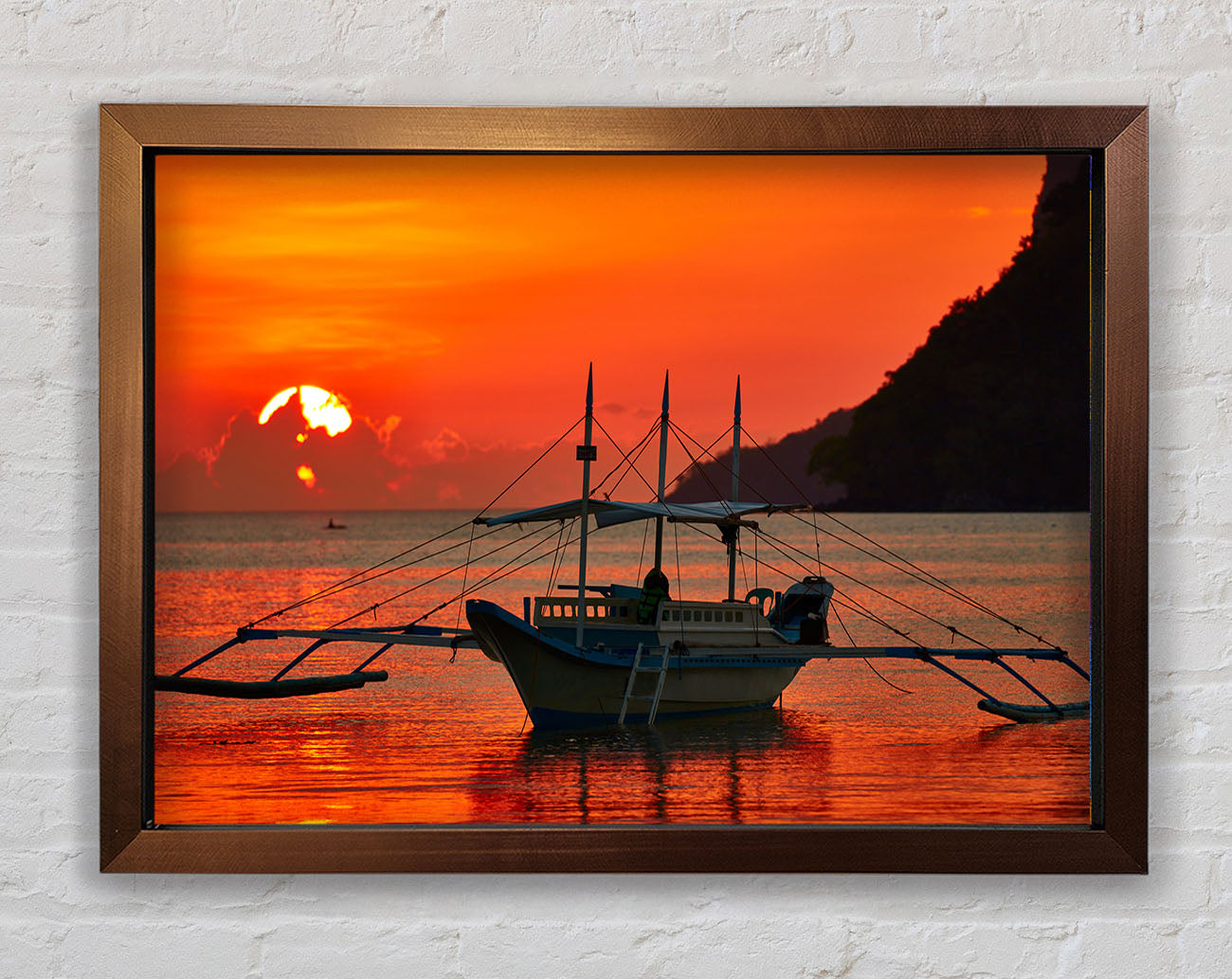 Boat sailing in the orange sunset Framed Wall Art