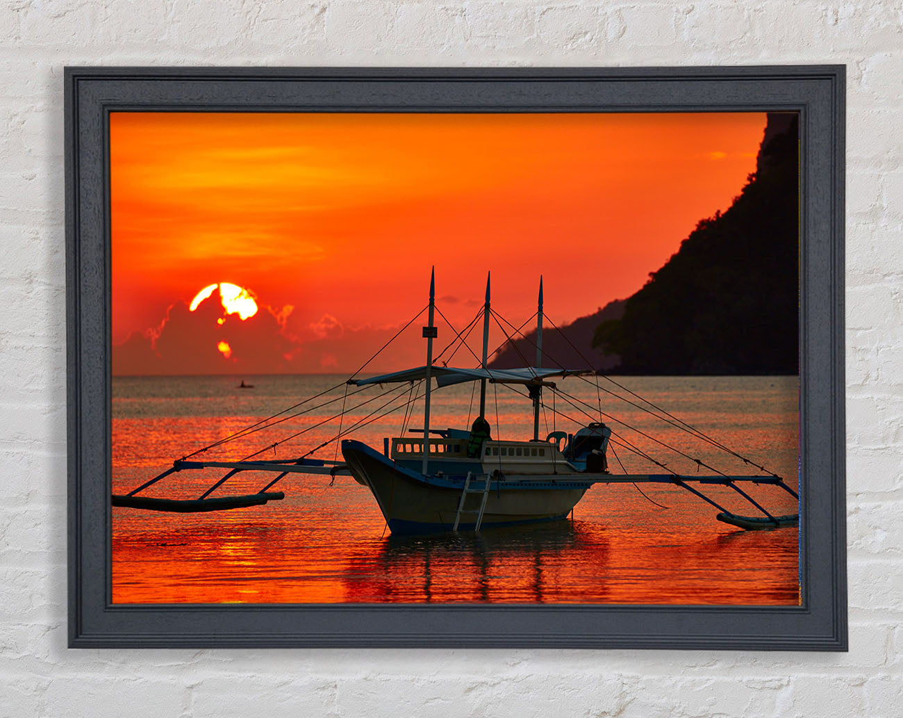 Boat sailing in the orange sunset Framed Wall Art