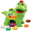 VTech Baby Feed Me Dino | Musical Baby Toy with Numbers, Counting Music & Shapes | Interactive Light Up Toy Suitable From 1, 2, 3 Year Olds Boys & Girls, Green, 27 x 12.3 x 26 cm