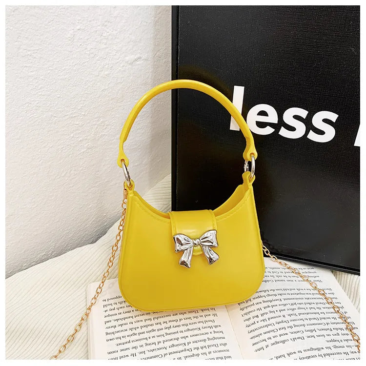 Women's PVC Solid Color Bow Knot Cute Dumpling Shape Buckle Handbag Crossbody Bag Jelly Bag