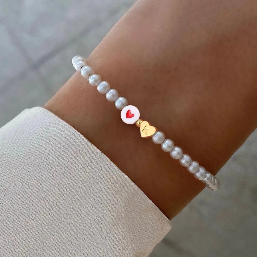Elegant Simple Style Classic Style Letter Heart Shape 304 Stainless Steel Artificial Pearl Plastic Wholesale Bracelets
