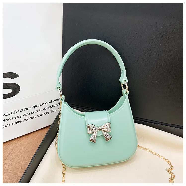 Women's PVC Solid Color Bow Knot Cute Dumpling Shape Buckle Handbag Crossbody Bag Jelly Bag