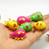 ladybird shaped colorful capsule toy with wheels